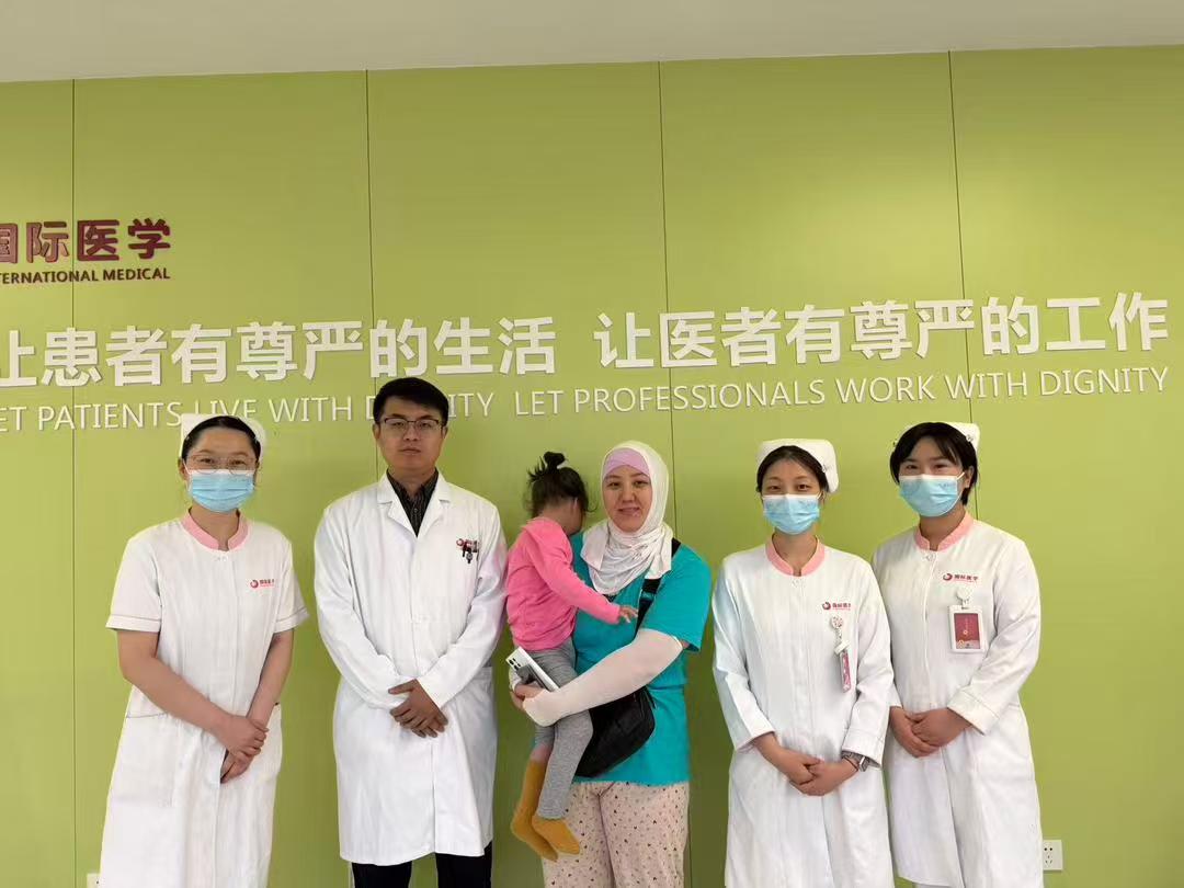 International family with hospital staff